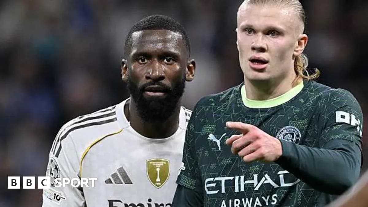 Two players in action during a football match Two players in action during a football match