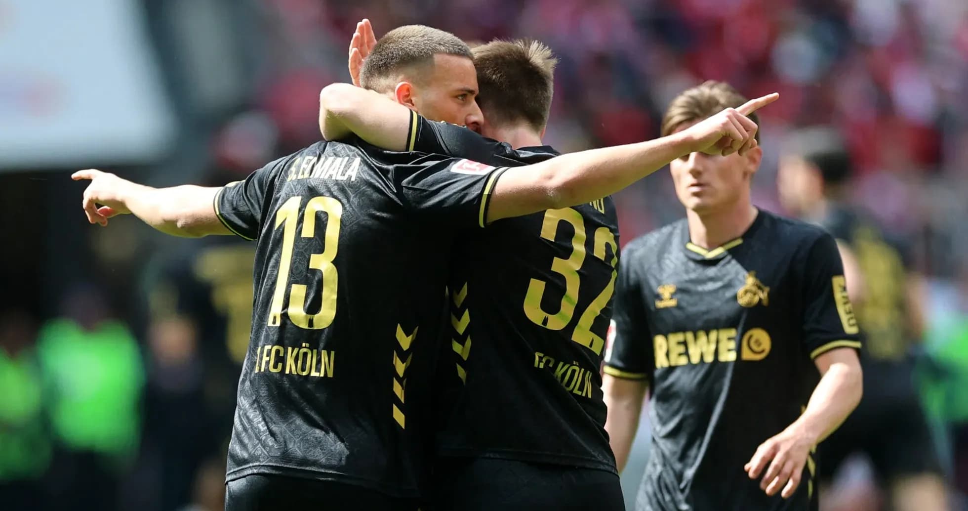 Players celebrating during a match for FC Köln Players celebrating during a match for FC Köln