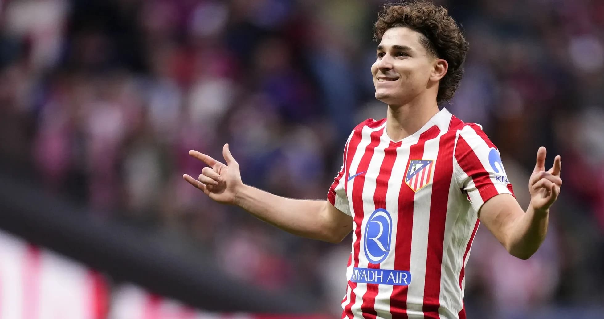 Player celebrating a goal for Atlético Madrid Player celebrating a goal for Atlético Madrid