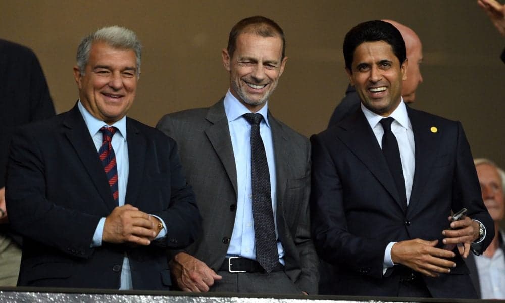 Three men smiling at an event or match Three men smiling at an event or match