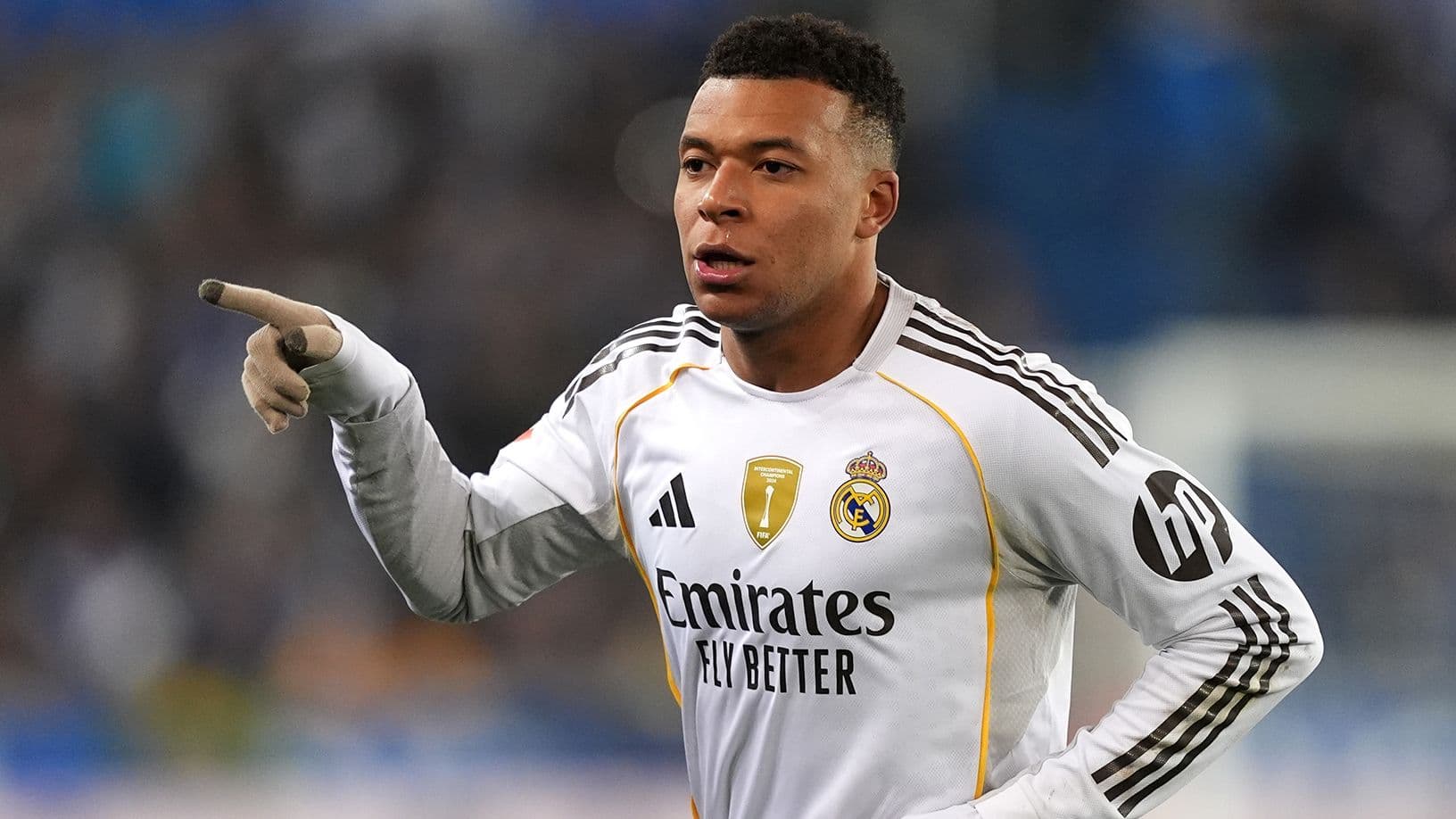 Player pointing during a football match Player pointing during a football match