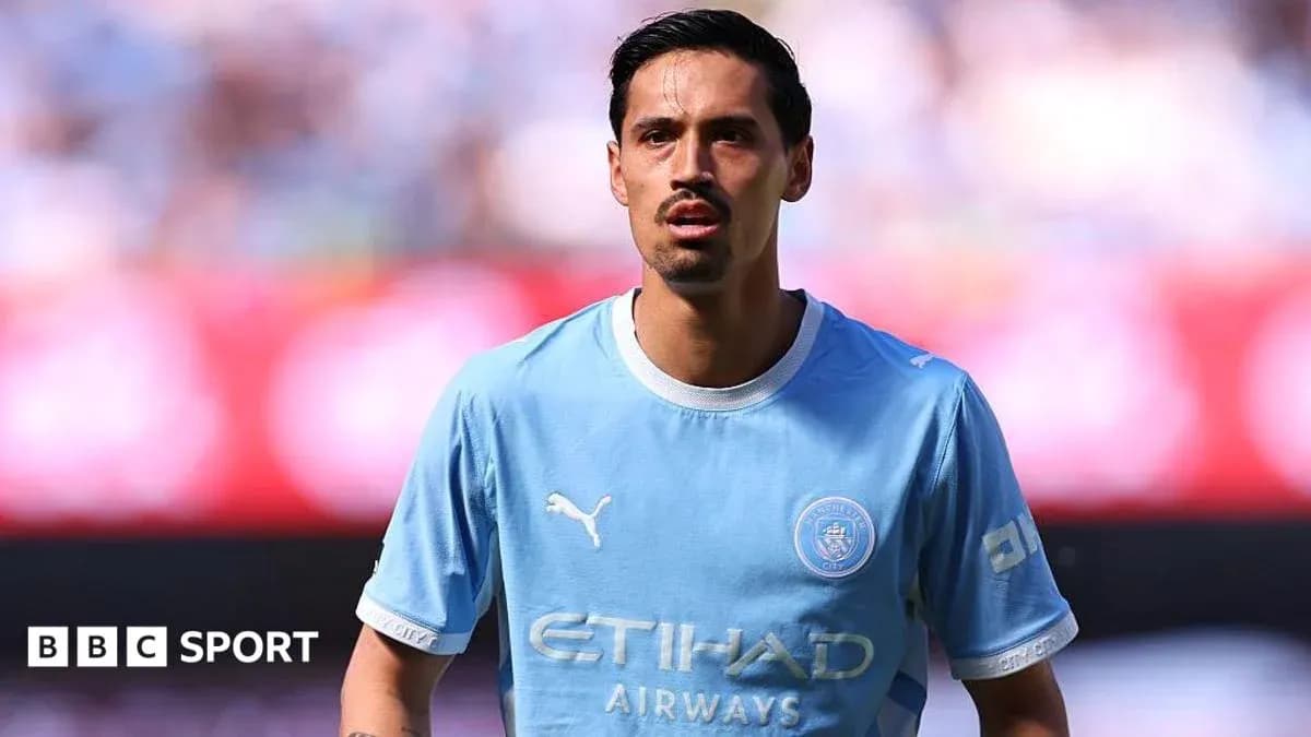 Player in light blue jersey during match warm-up Player in light blue jersey during match warm-up