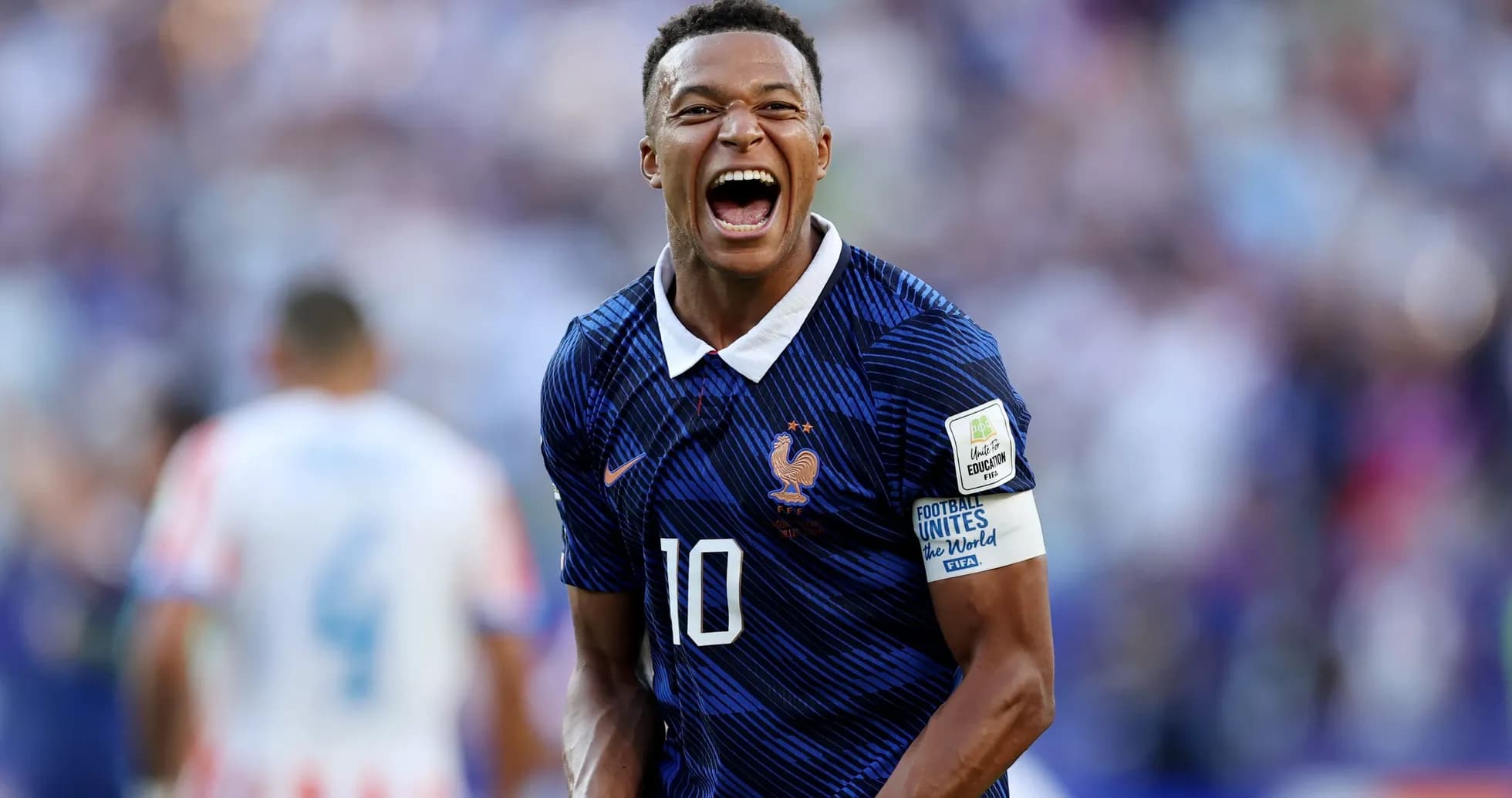 Player celebrating after scoring during a match Player celebrating after scoring during a match