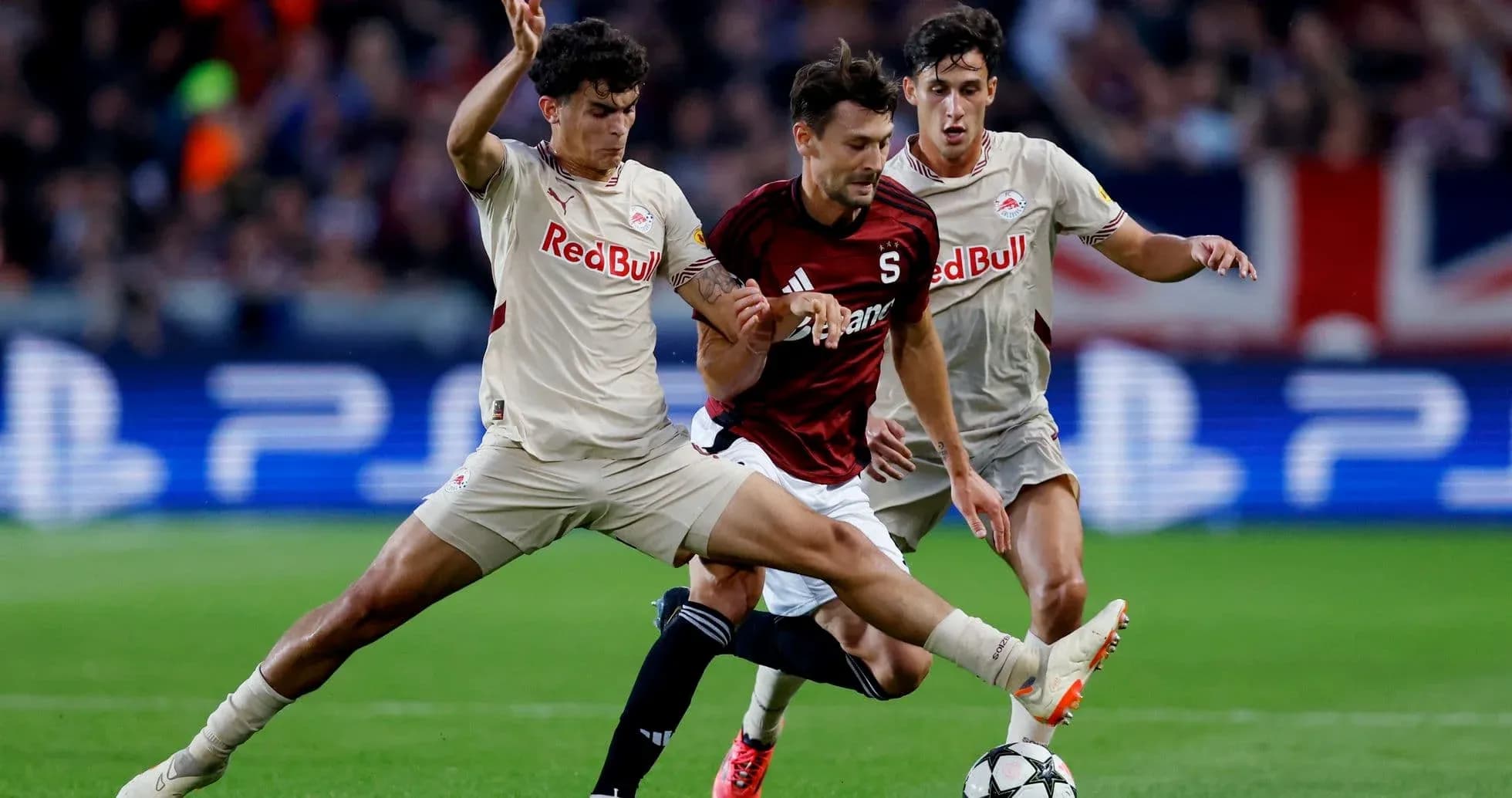 Red Bull Salzburg players challenging Sparta Praha player Red Bull Salzburg players challenging Sparta Praha player