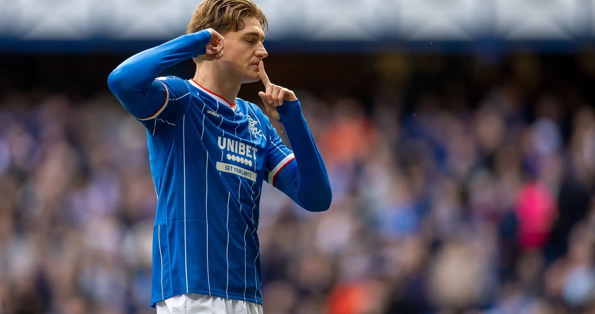 Player signaling silence after scoring a goal Player signaling silence after scoring a goal