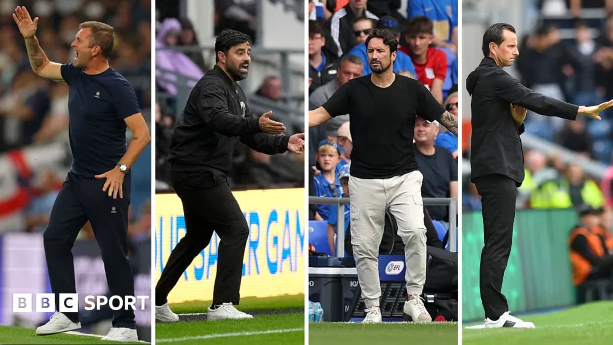 Four football managers giving instructions on the sideline Four football managers giving instructions on the sideline