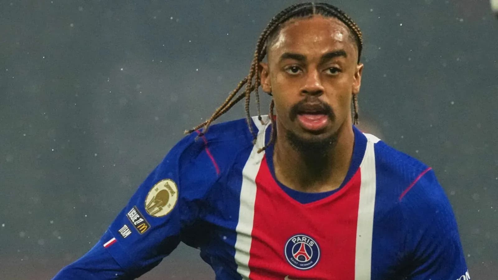 Player running in PSG jersey during match Player running in PSG jersey during match