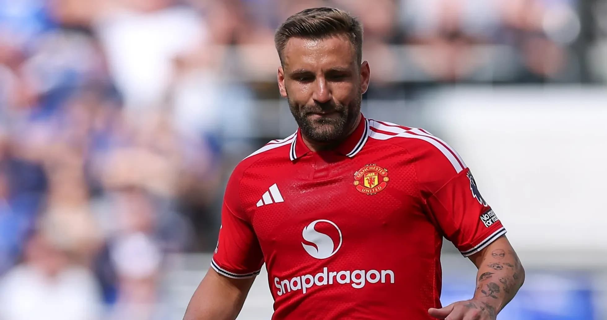 Player wearing Manchester United jersey on the field Player wearing Manchester United jersey on the field