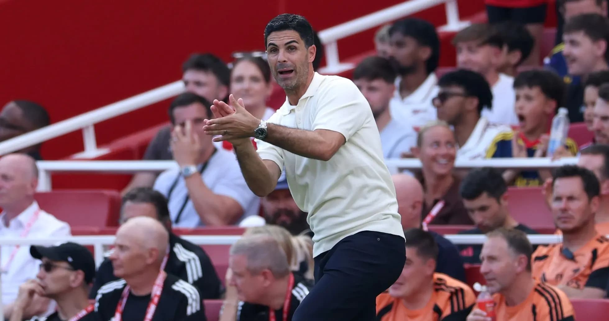 Manager instructing players from the sidelines during match Manager instructing players from the sidelines during match