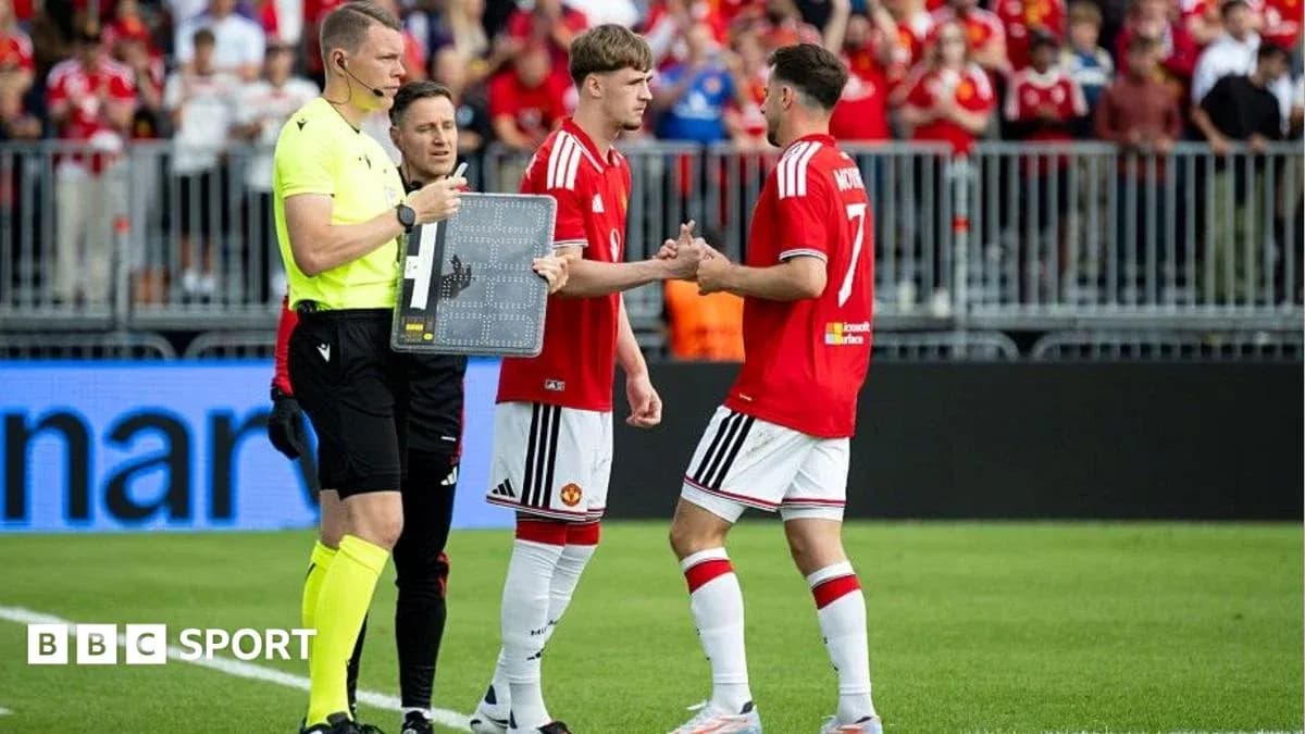 Substitution during Manchester United match on field Substitution during Manchester United match on field