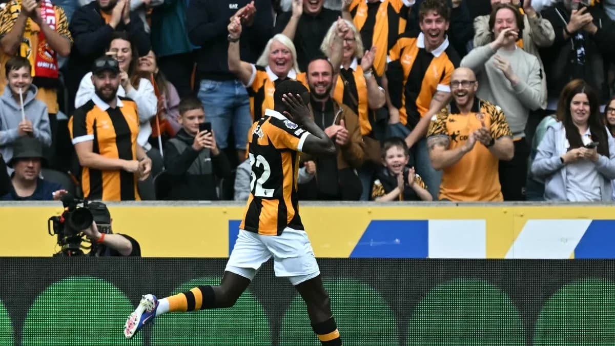 Player celebrating in front of cheering fans Player celebrating in front of cheering fans