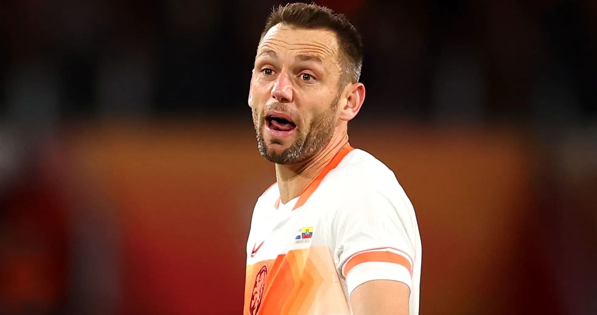 Player in orange jersey during a match Player in orange jersey during a match