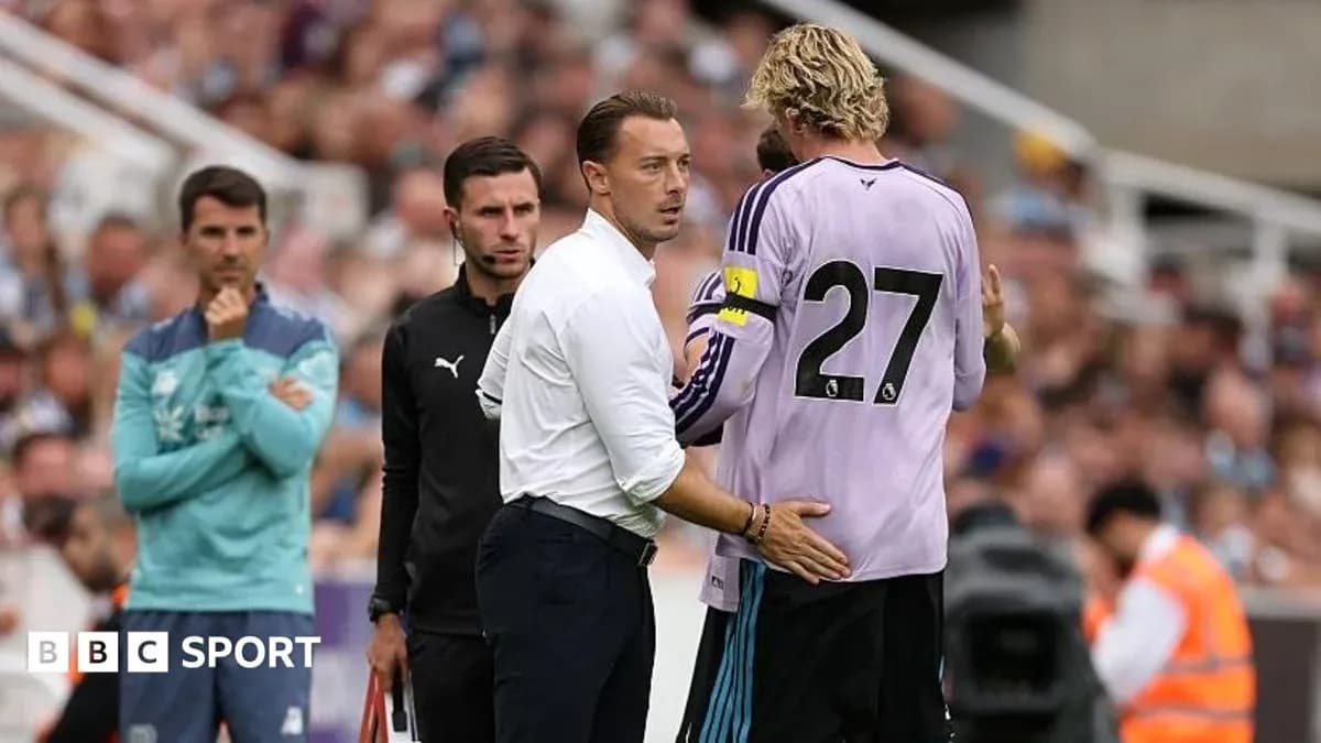 Coach talking to goalkeeper during match substitution Coach talking to goalkeeper during match substitution