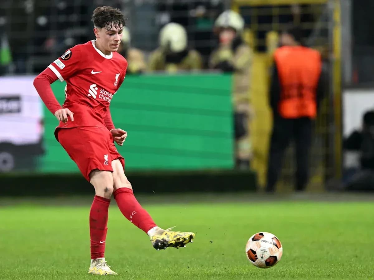 Player kicking the ball during a match Player kicking the ball during a match