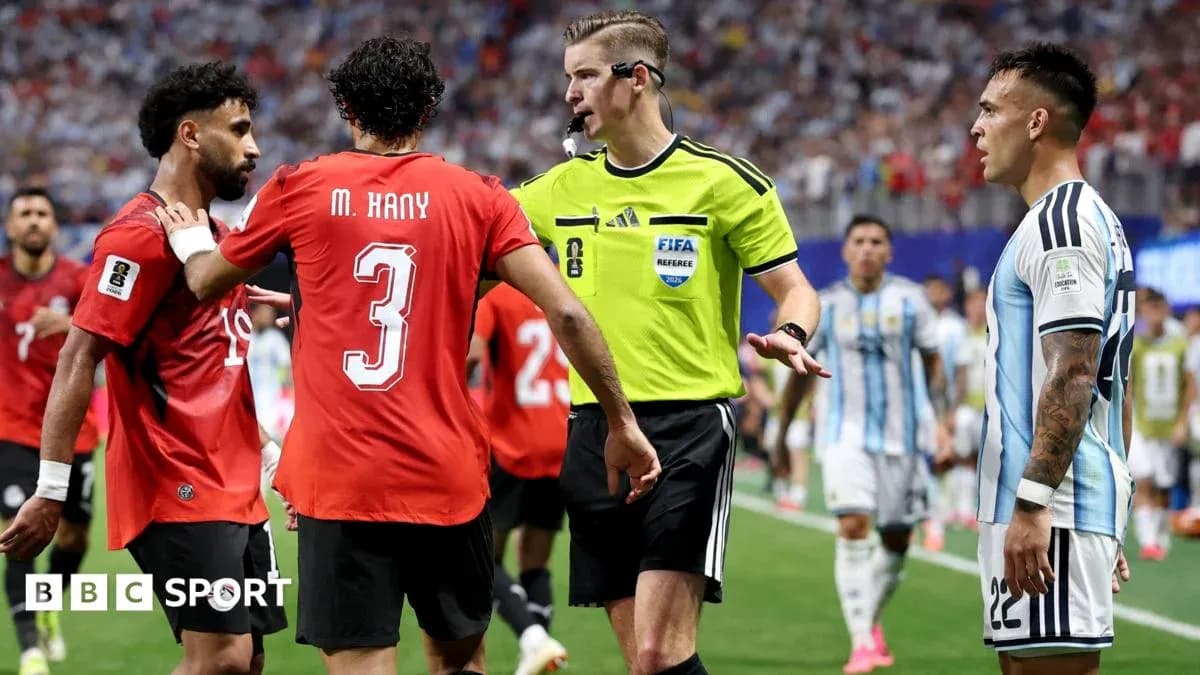 Players and referee discussing during football match Players and referee discussing during football match