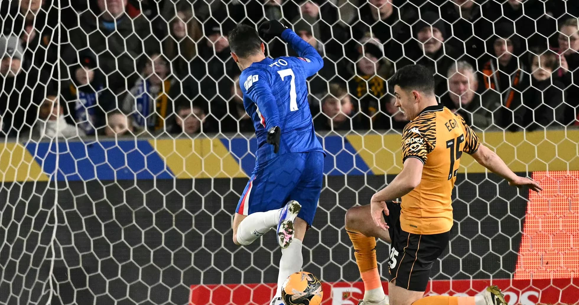 Chelsea player attempting to score against Hull City Chelsea player attempting to score against Hull City