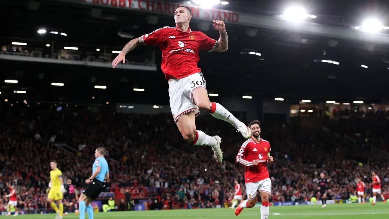 Player celebrating goal with teammates at Old Trafford Player celebrating goal with teammates at Old Trafford