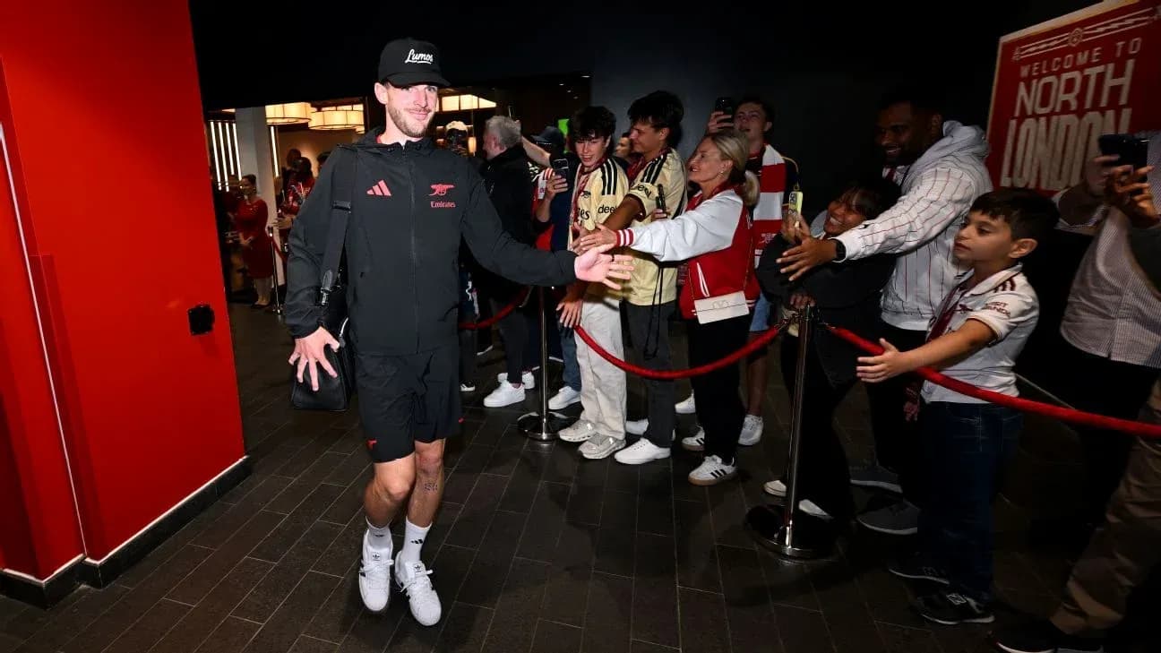 Player greeting fans in a venue entrance area Player greeting fans in a venue entrance area