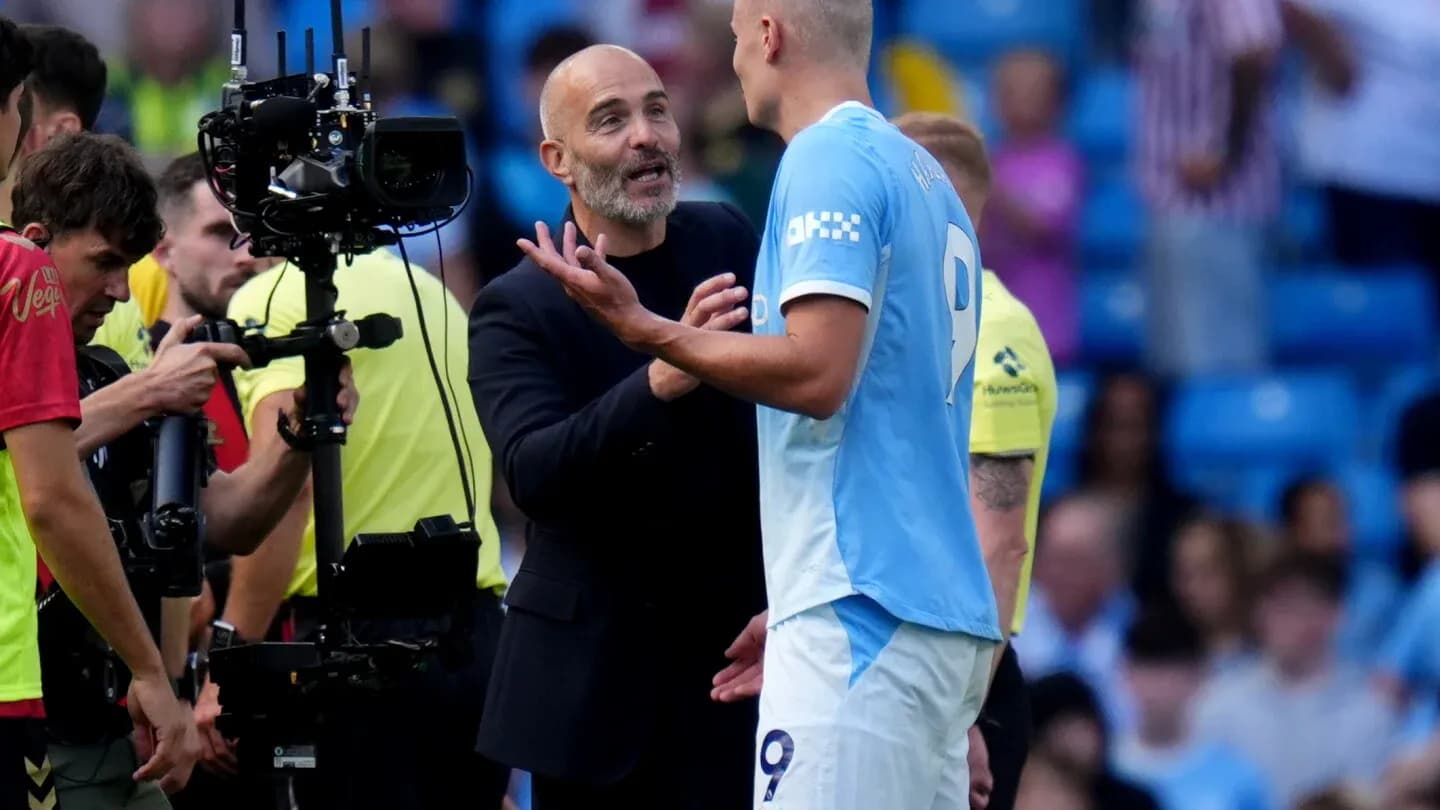 Coach discussing with player during match stoppage Coach discussing with player during match stoppage