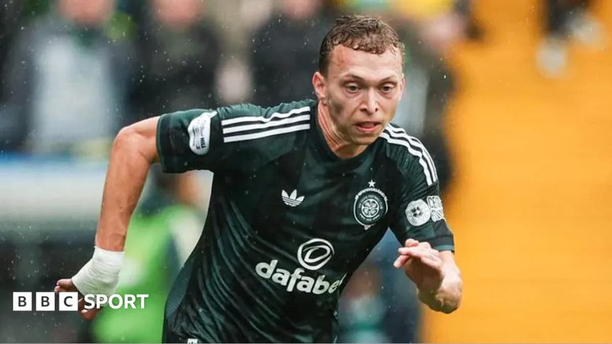 Player sprinting in dark green football kit Player sprinting in dark green football kit