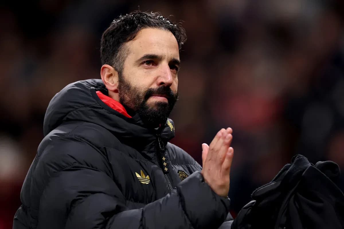 Coach applauding fans in a stadium setting Coach applauding fans in a stadium setting