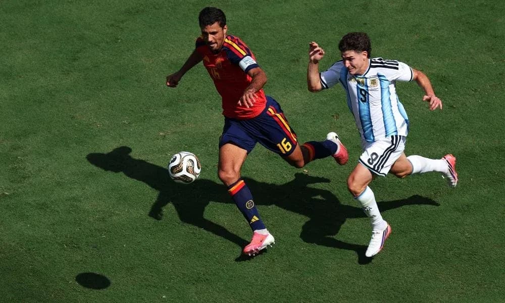 Two players racing for the ball during match Two players racing for the ball during match