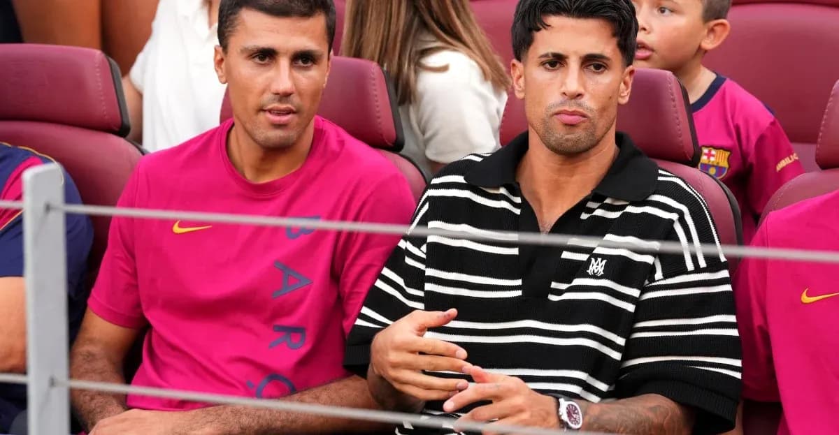Two men sitting in stadium seats, wearing team colors Two men sitting in stadium seats, wearing team colors