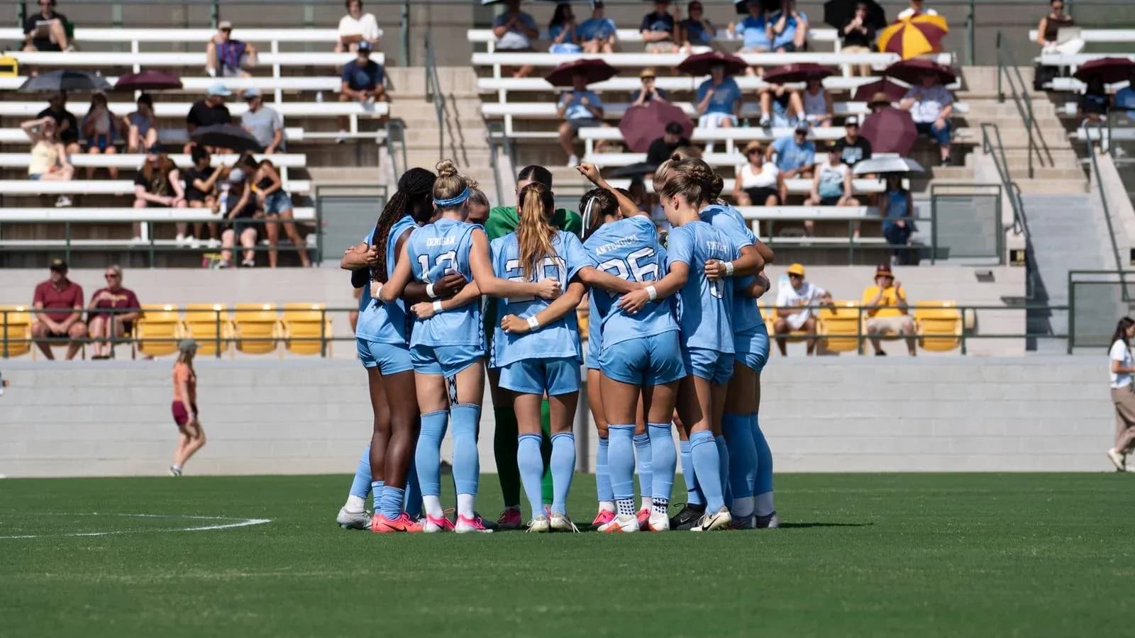 Team huddling together before the match Team huddling together before the match