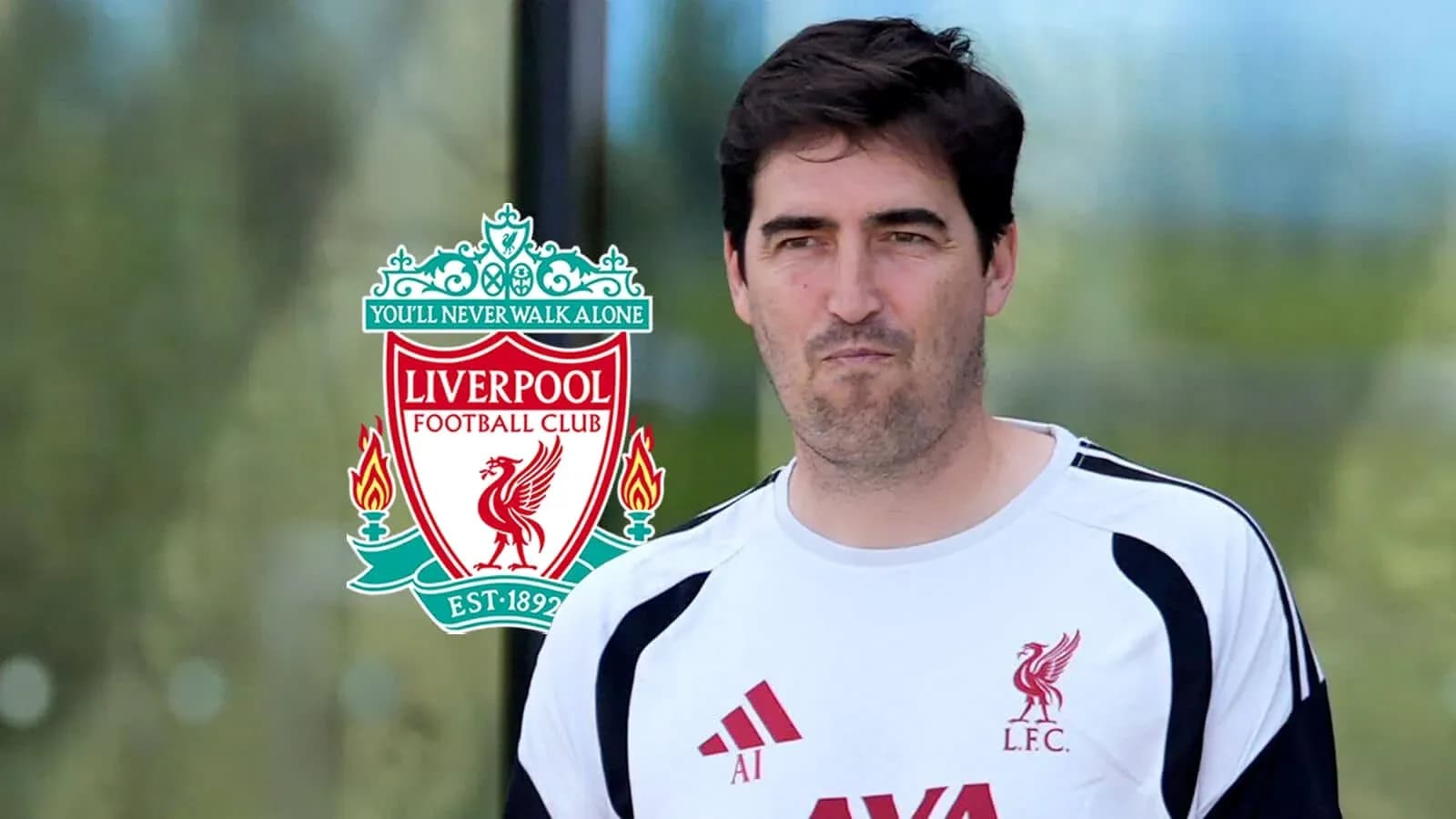 Coach wearing Liverpool FC training gear Coach wearing Liverpool FC training gear