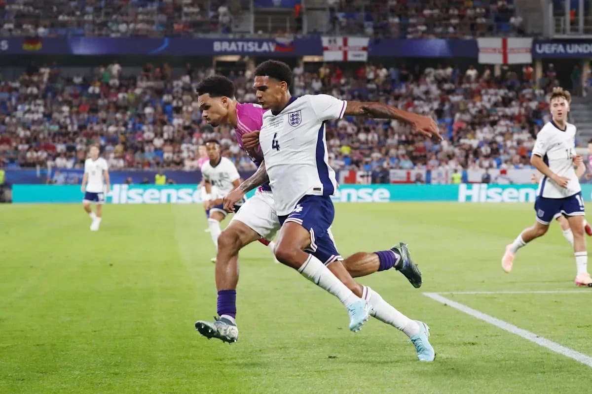 Two players competing for the ball during match Two players competing for the ball during match