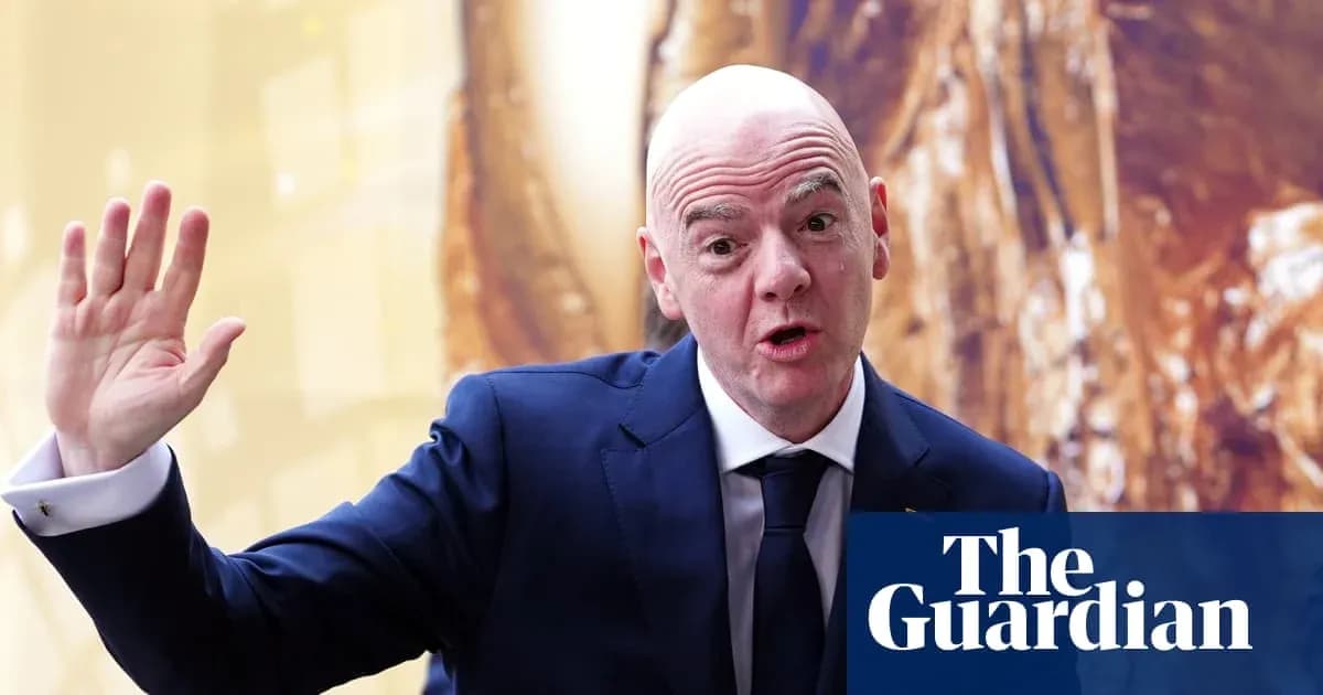 Man in suit gesturing while speaking at event Man in suit gesturing while speaking at event