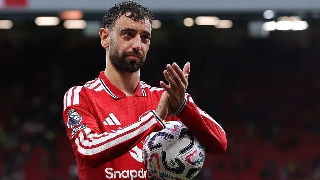 Player applauding while holding a soccer ball Player applauding while holding a soccer ball