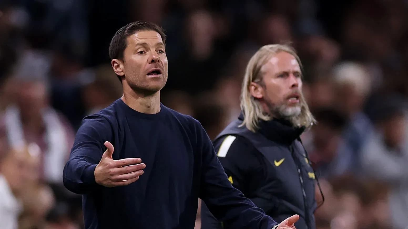 Coaches gesturing during a match from the sidelines Coaches gesturing during a match from the sidelines
