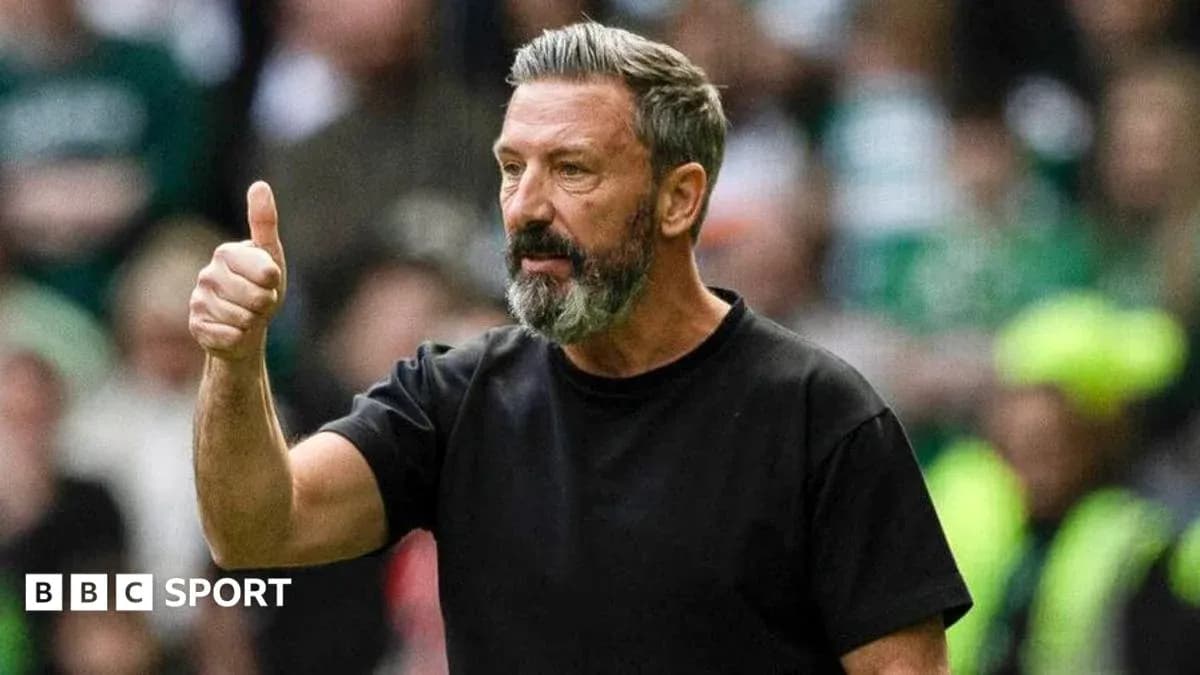 Manager giving a thumbs up during match Manager giving a thumbs up during match