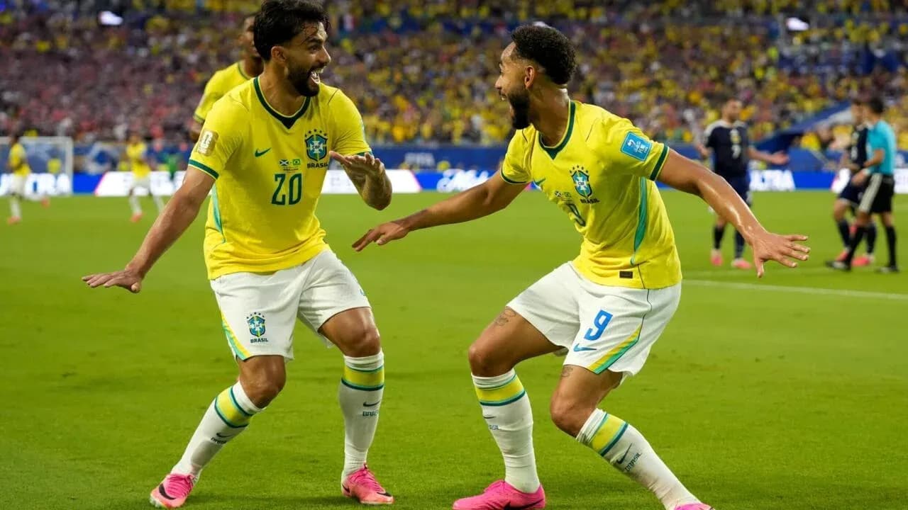 Two Brazil players celebrating a goal on field Two Brazil players celebrating a goal on field