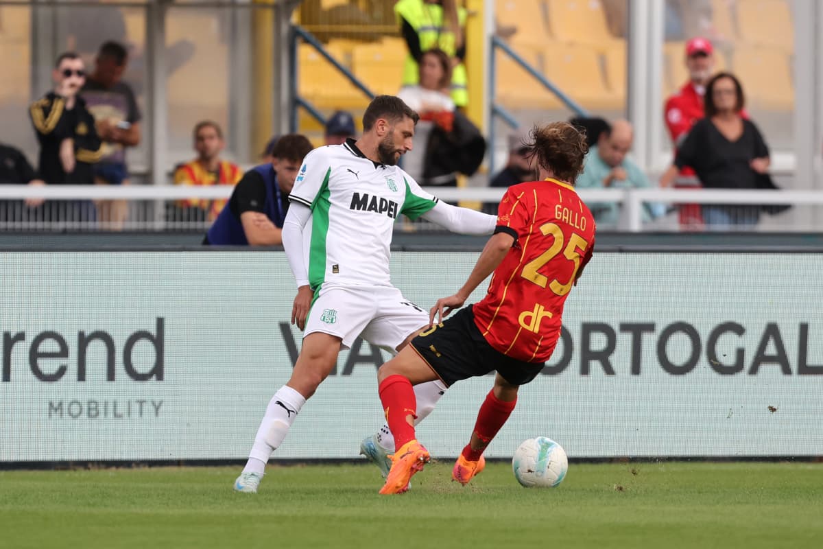 Sassuolo player challenging Lecce opponent for the ball Sassuolo player challenging Lecce opponent for the ball