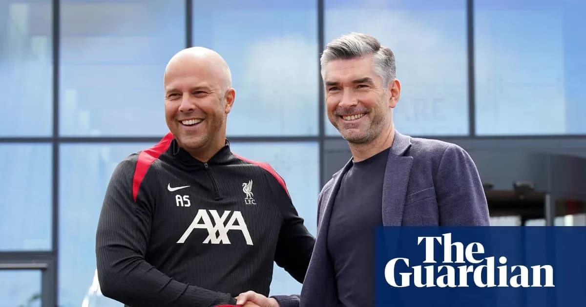 Two men shaking hands outside Liverpool training facility Two men shaking hands outside Liverpool training facility