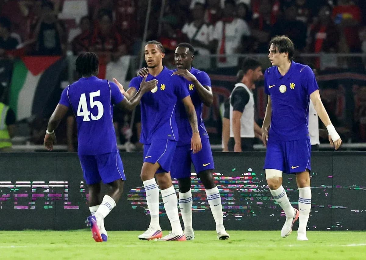Four players celebrating on the field during match Four players celebrating on the field during match