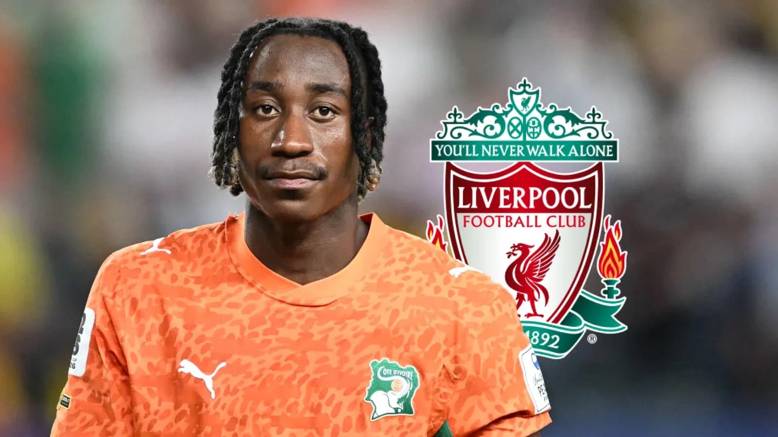 Player in orange jersey with Liverpool logo backdrop Player in orange jersey with Liverpool logo backdrop