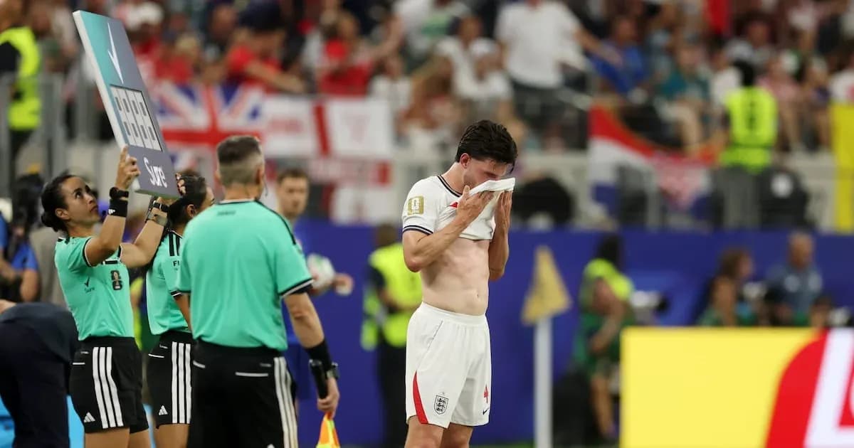 Player wiping face during substitution in match Player wiping face during substitution in match