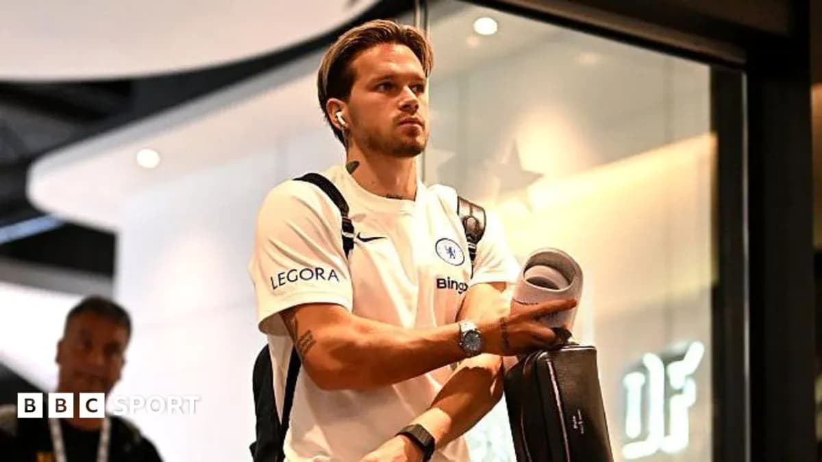 Player arriving at airport wearing Chelsea jersey Player arriving at airport wearing Chelsea jersey