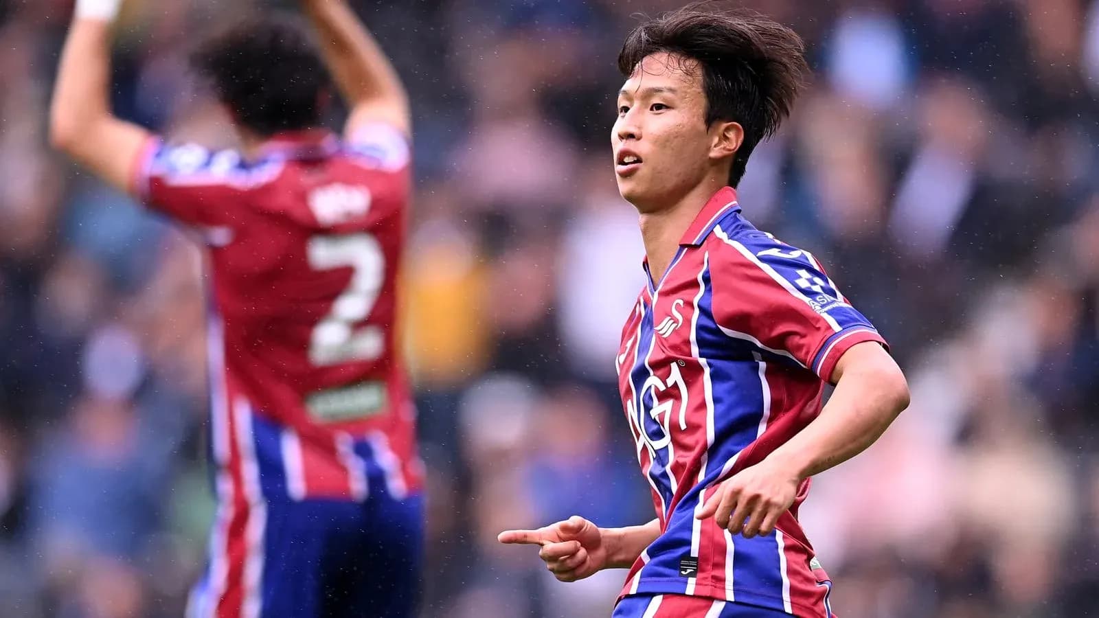 Player celebrating a goal on the field Player celebrating a goal on the field
