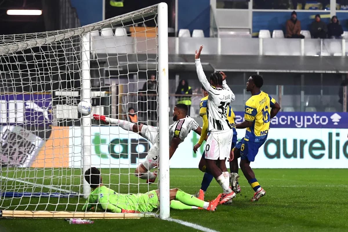 Goalkeeper attempting to save a shot on goal Goalkeeper attempting to save a shot on goal