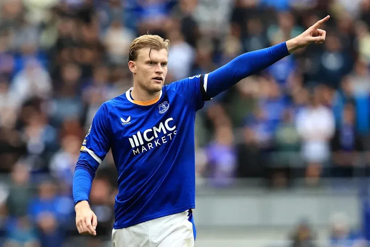 Player in blue jersey gesturing on the field Player in blue jersey gesturing on the field