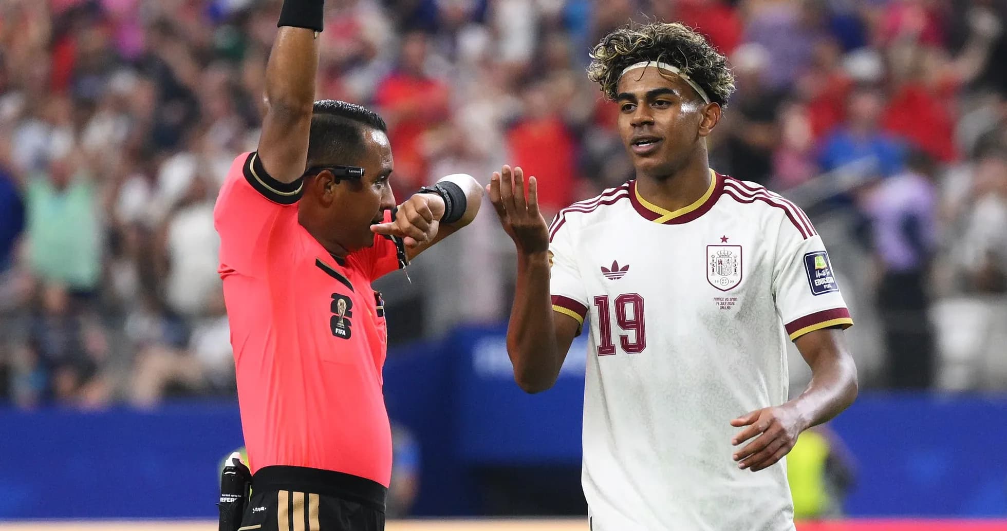 Referee issuing a warning to player during match Referee issuing a warning to player during match