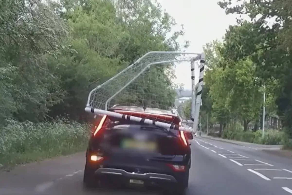 Car transporting a soccer goal on the roof Car transporting a soccer goal on the roof