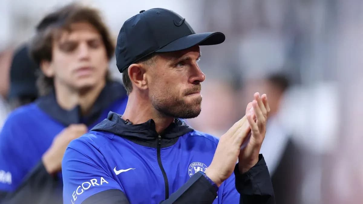 Coach applauding during match with players behind Coach applauding during match with players behind