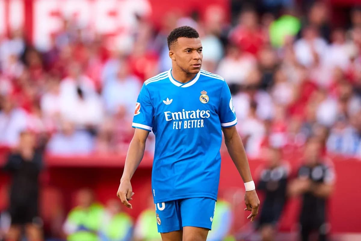 Player in blue Real Madrid jersey on the field Player in blue Real Madrid jersey on the field