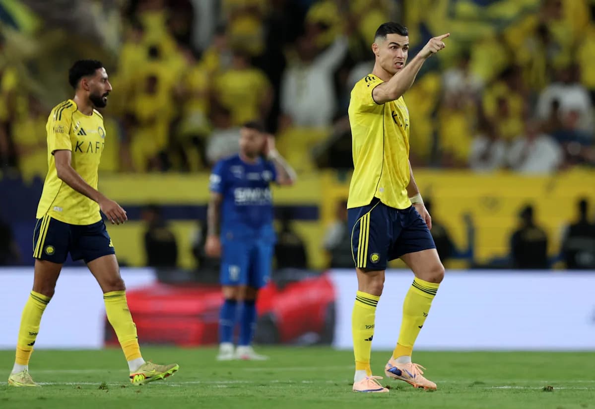 Two players discussing during a football match Two players discussing during a football match