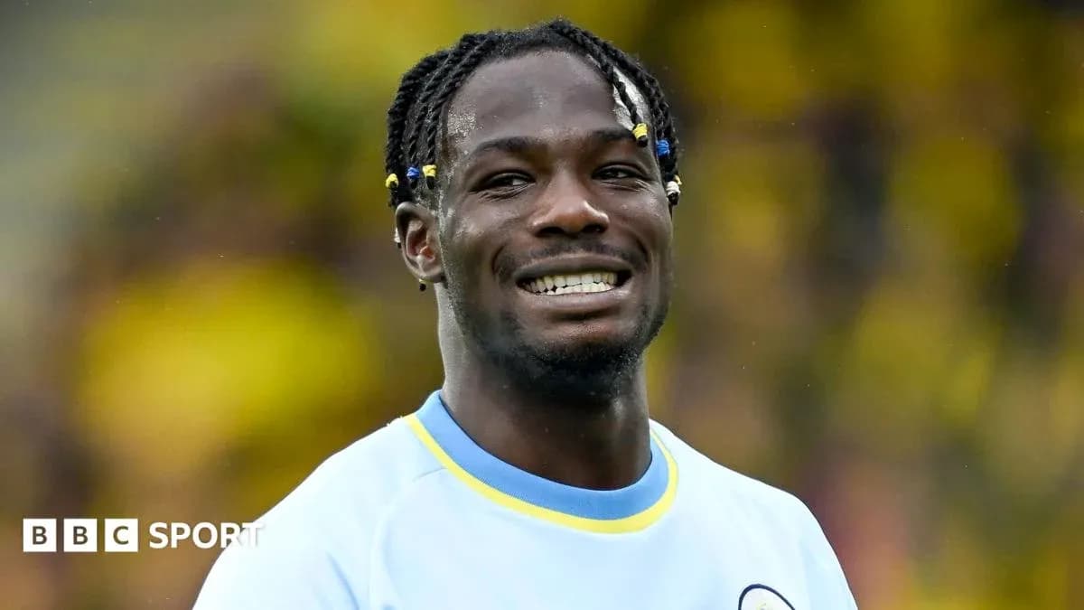 Player smiling in team jersey during match Player smiling in team jersey during match